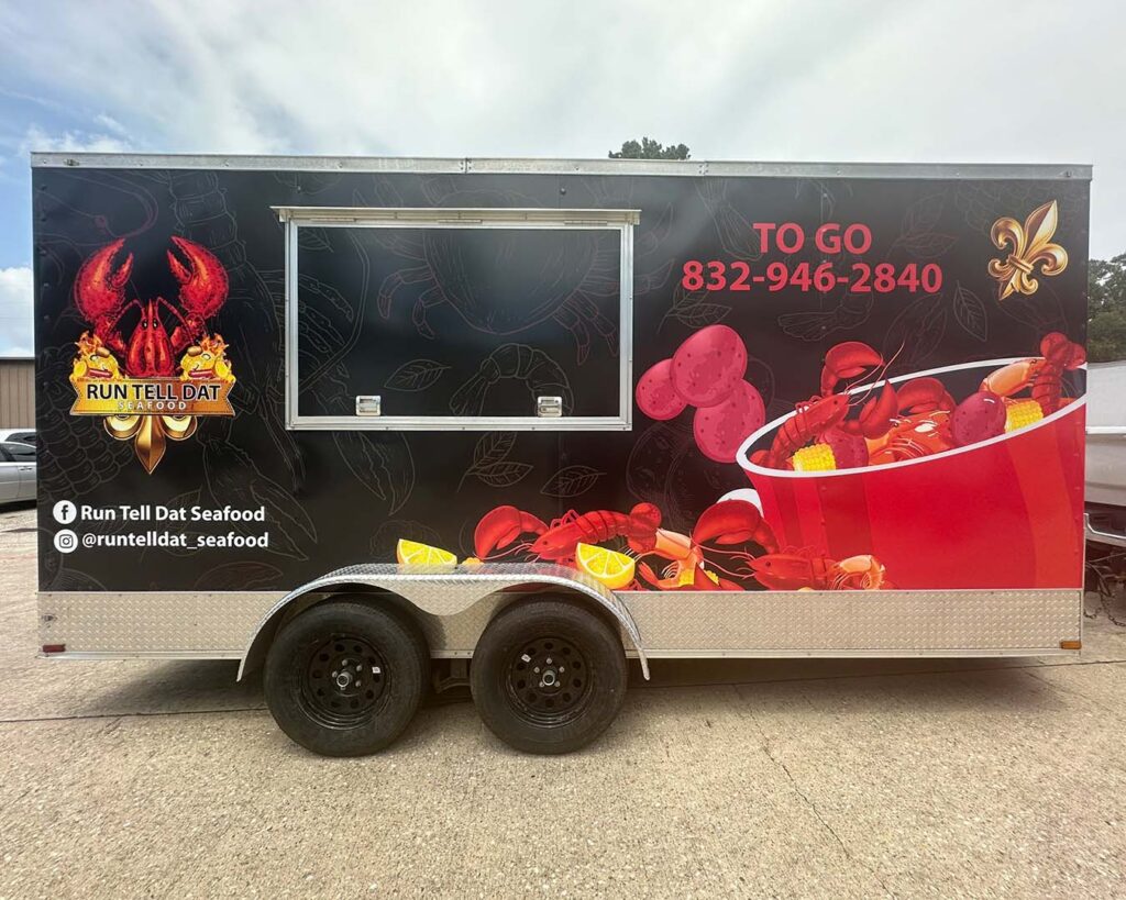 Run Tell Dat Sea food trailer wrap, performed by CSPrinting in Houston, Texas